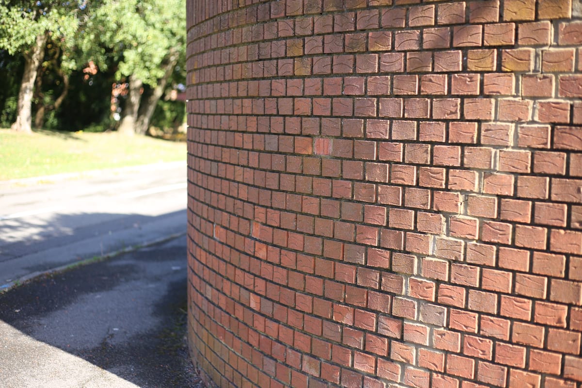 Curved brick wall